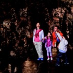 A family enjoying a visit to Postojna Cave, Slovenia